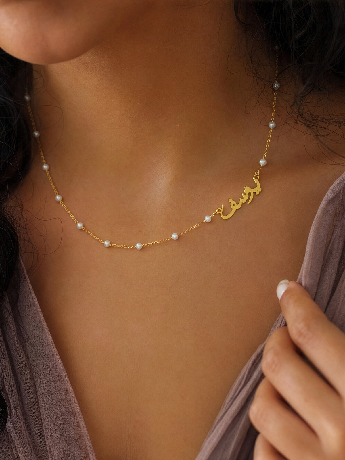 Editorial — SOLENE. Pearl Name Necklace in 21k gold — on model · Arabic