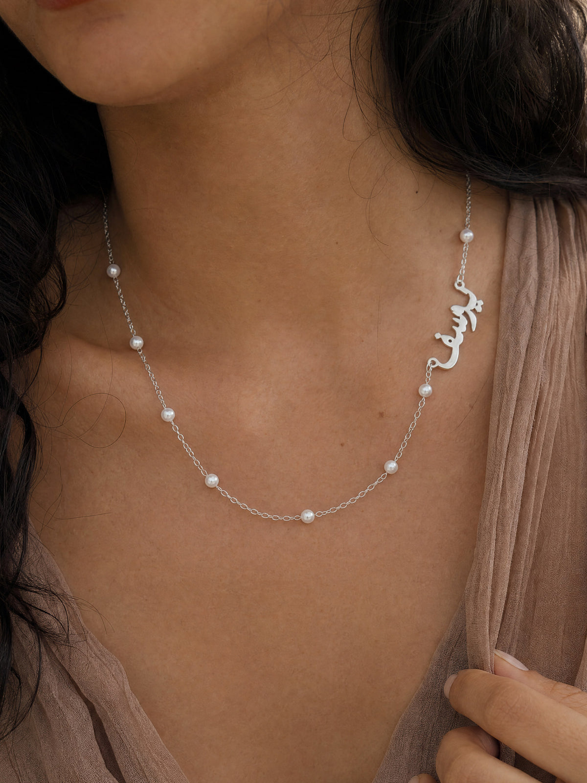 Editorial — SOLENE. Pearl Name Necklace in 925 silver — on model · Arabic