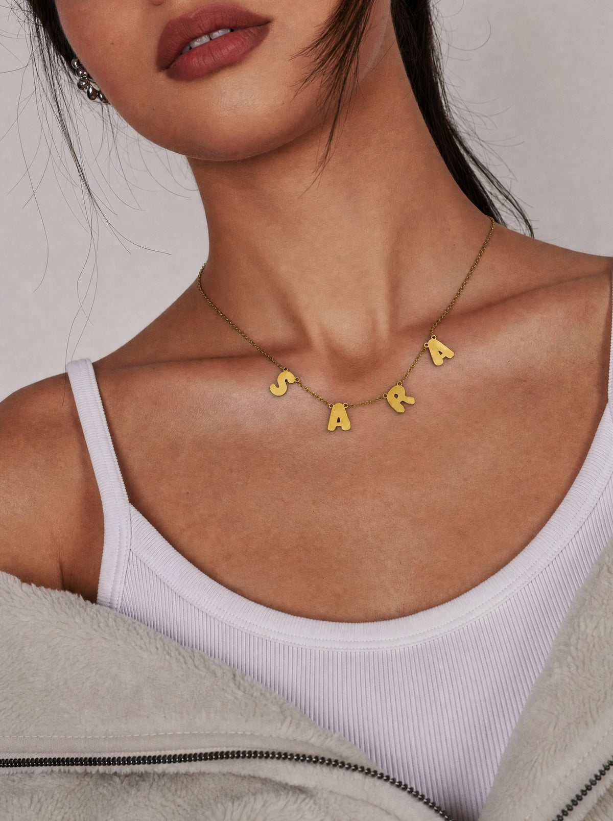Editorial — SOLENE. Floating Letters Necklace in 21k gold — on model