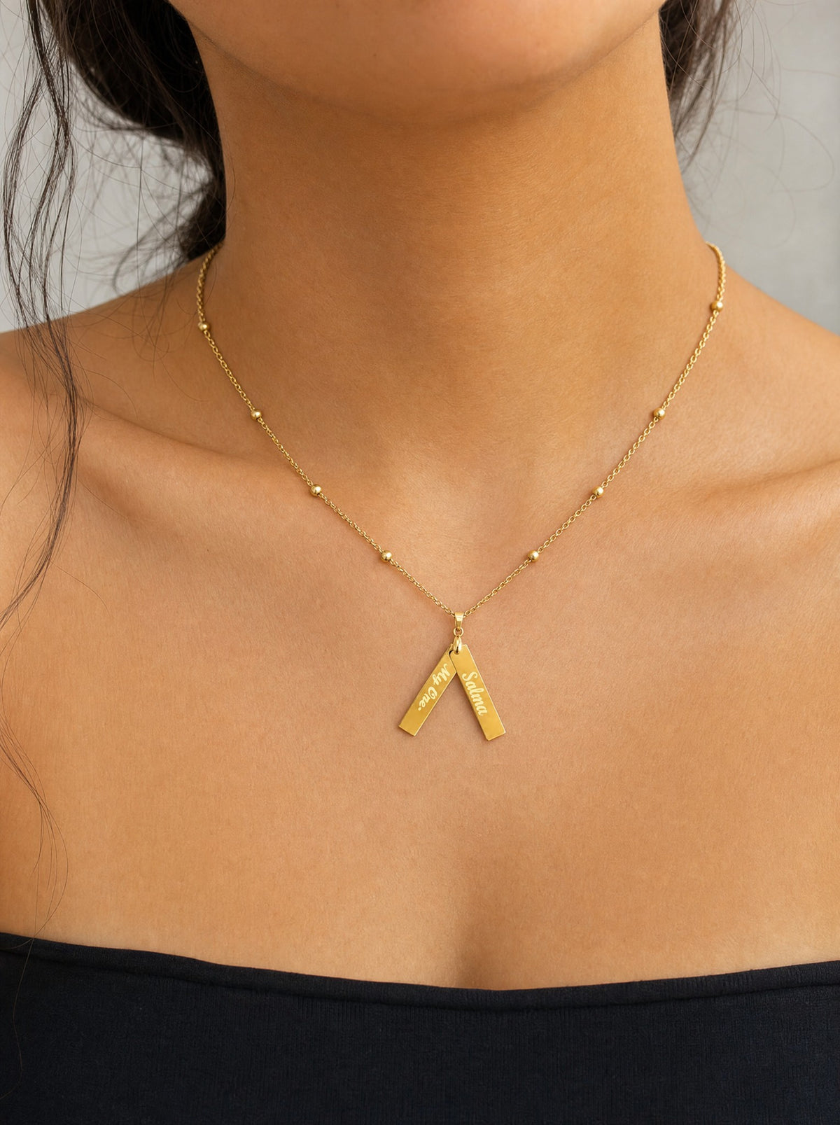 Editorial — SOLENE. Keepsake Tags Necklace in 21k gold — on model