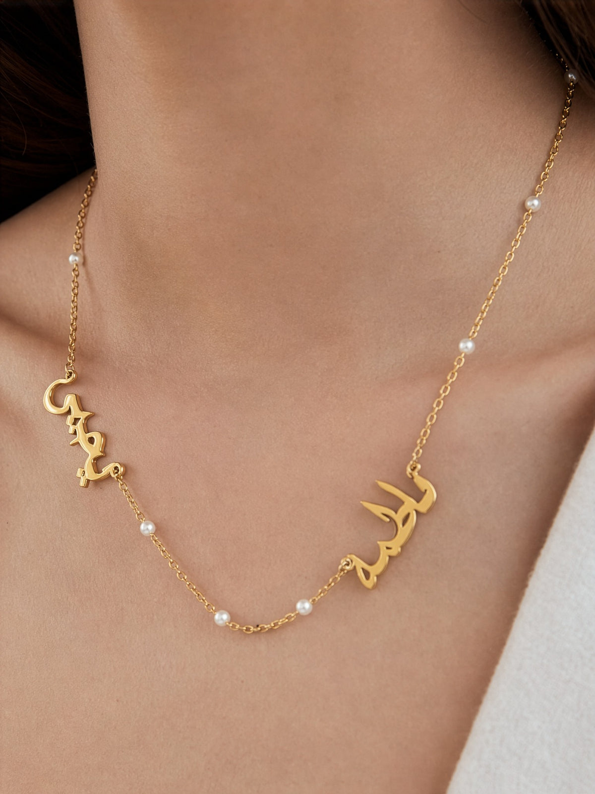 Editorial — SOLENE. Pearl Names Necklace in 21k gold — on model · Arabic