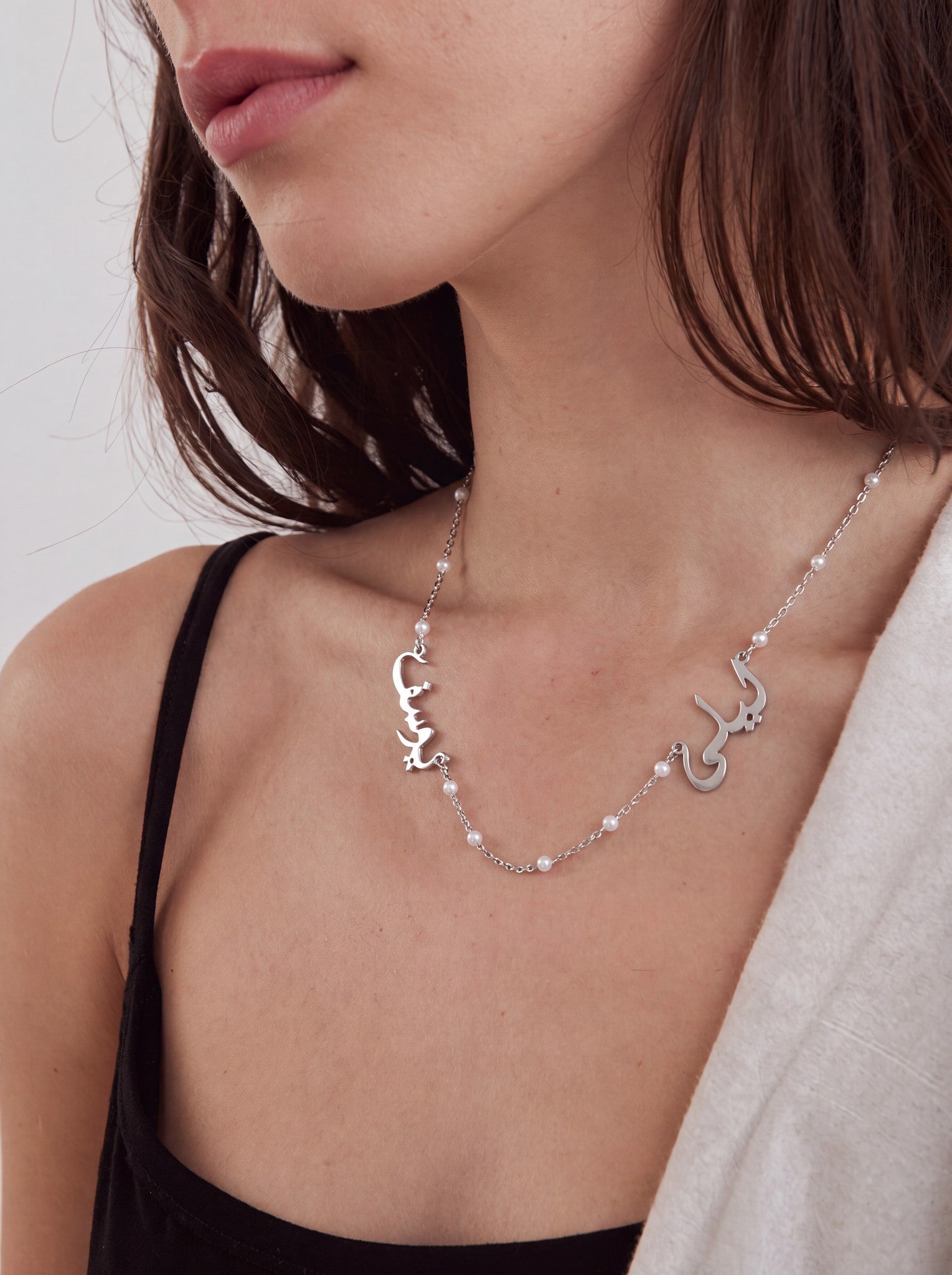 Editorial — SOLENE. Pearl Names Necklace in 925 silver — on model · Arabic